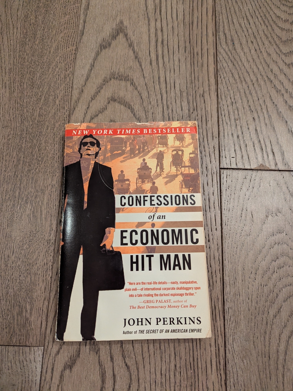 John Perkins Confessions of an Economic Hit Man - Orange/Black Cover